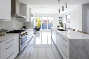 Modern Melbourne kitchen featuring large-format marble-look floor tiles, a white tiled island bench, and contemporary cabinetry designed for stylish and durable everyday living.