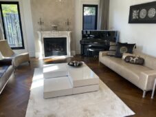 Modern living room home renovation with hardwood flooring, custom fireplace, and luxury interior design by 5J Building Melbourne